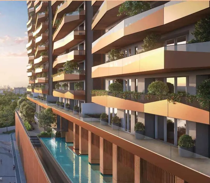 Tiered balconies above the podium pool at Sri Aditya Vantage