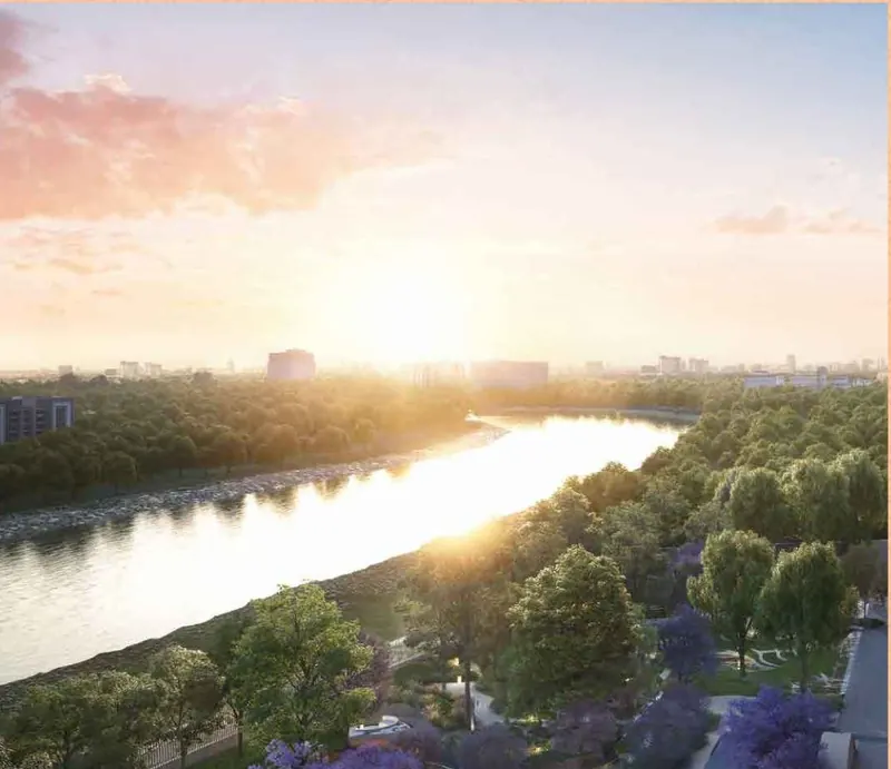 Sunrise over the river and green buffer beside Sri Aditya Vantage